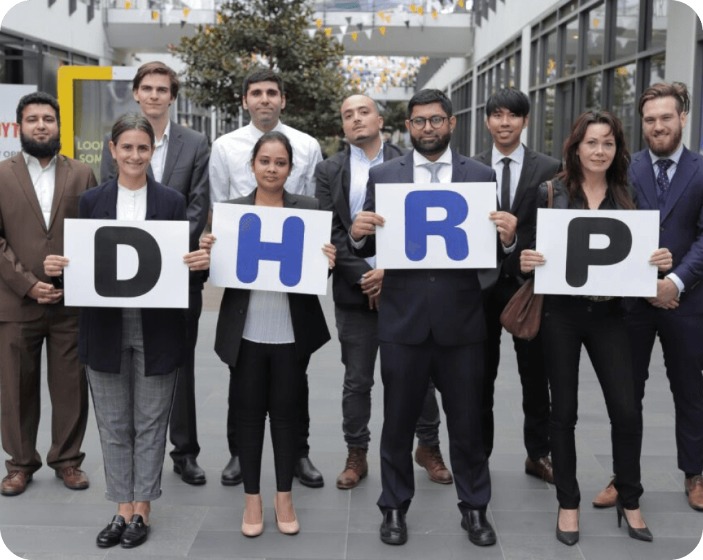 DHRP team holding brand letters